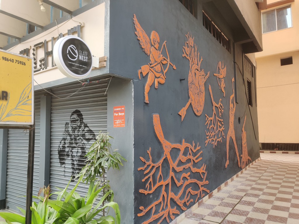 Mural on the side wall of the building of Slate Nest